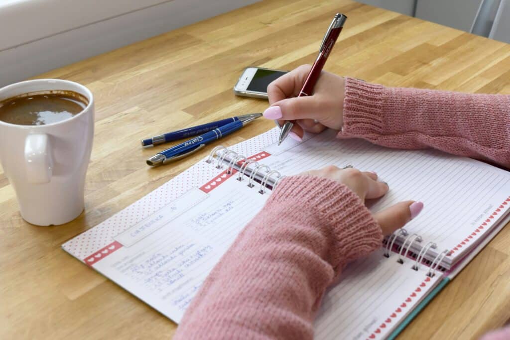 Add business days to a date — person planning in a diary