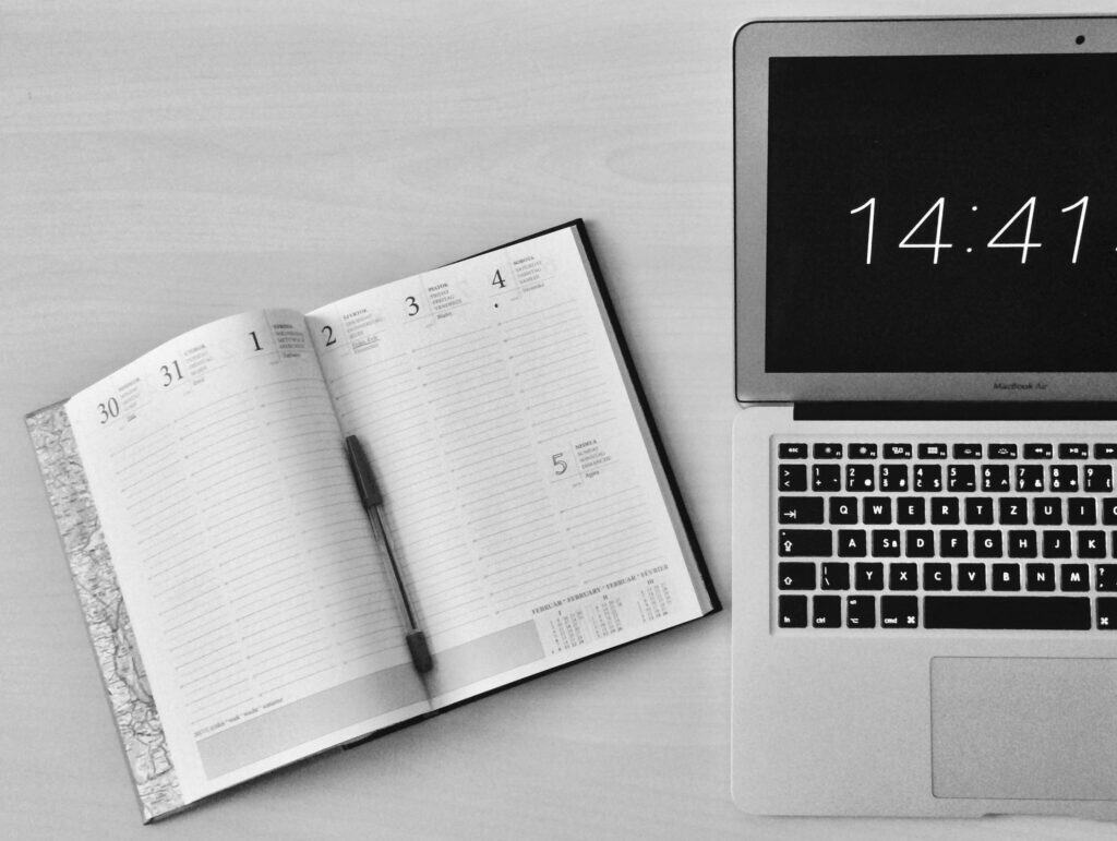 Deadline calculator — planner and laptop showing time