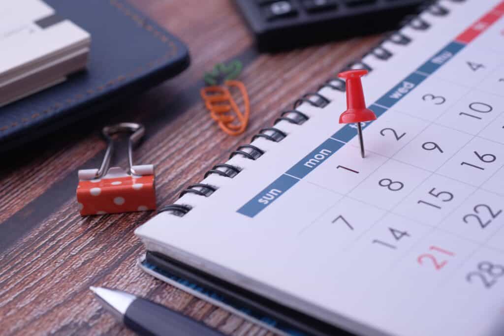 person reviewing a calendar page to determine if the first day counts when calculating a business day deadline